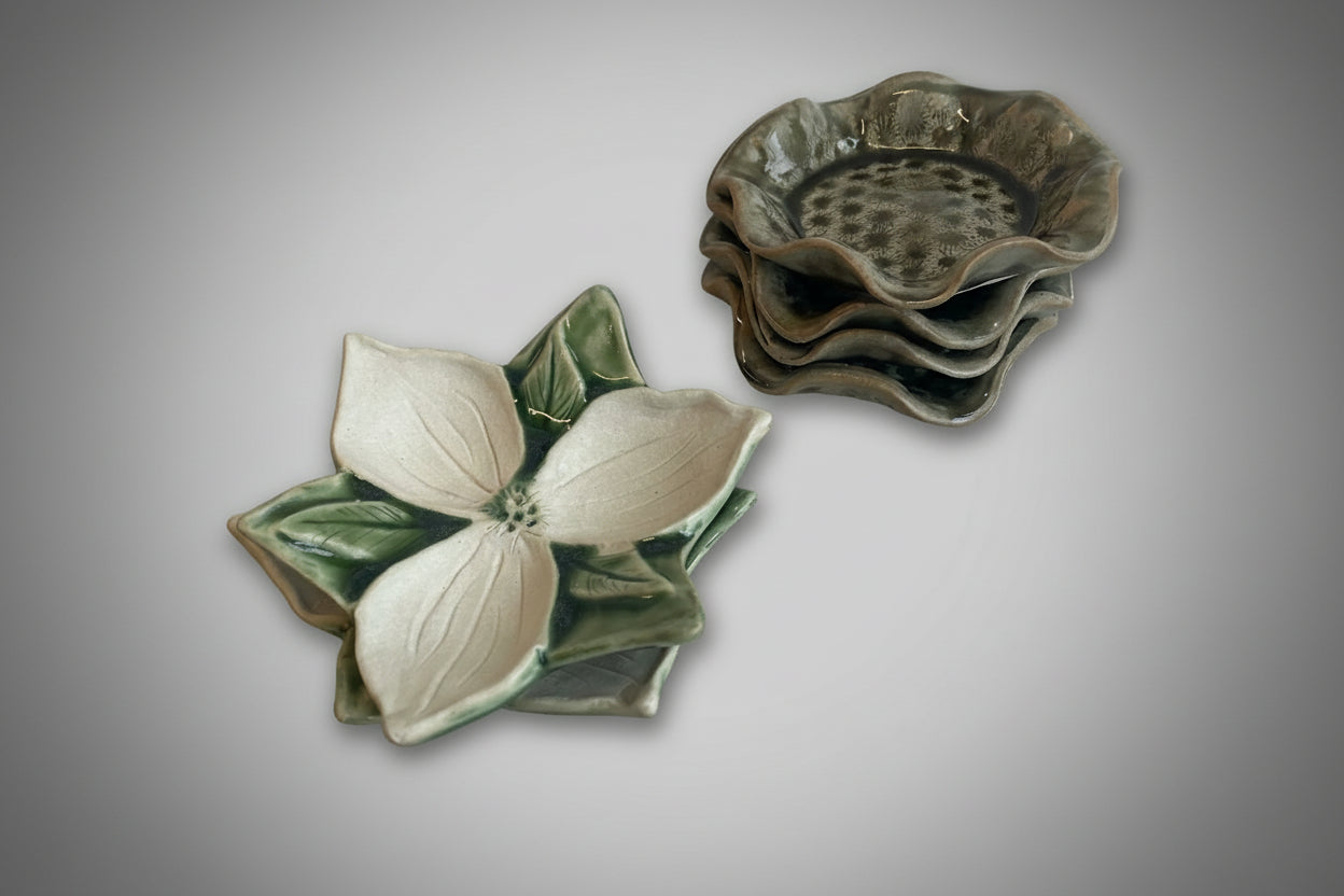 Small ceramic Trinket dishes, one looks like a trillium flower and one has a scalloped edge and Petoskey stone pattern  